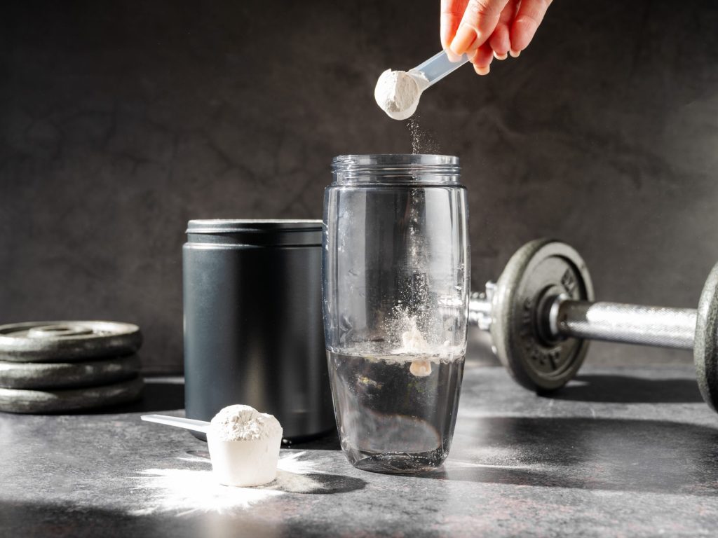 Amino,Acid,Food,Supplement,,Creatine,Powder,In,A,Measuring,Scoop
